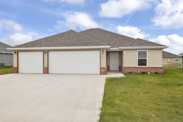 ranch-style house featuring a front yard, driveway, roof with shingles, an attached garage, and brick siding