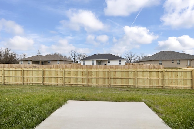 view of yard featuring a patio and fence