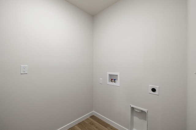 washroom featuring hookup for a washing machine, baseboards, hookup for an electric dryer, laundry area, and light wood-type flooring