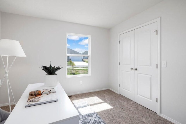 home office with carpet flooring and baseboards