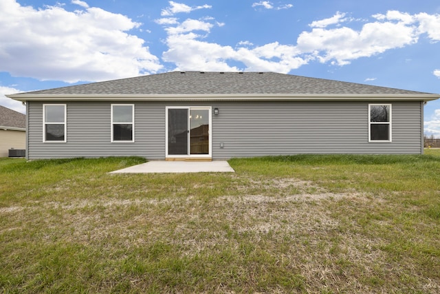 1756 Cash Dr, Mount Vernon, MO 65712 - back of property with a yard, a patio area, central AC, and a shingled roof