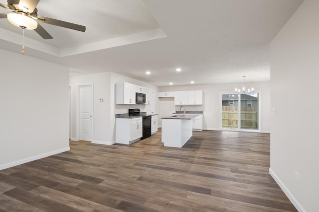 1756 Cash Dr, Mount Vernon, MO 65712 - kitchen with black appliances, dark countertops, open floor plan, dark wood finished floors, and baseboards