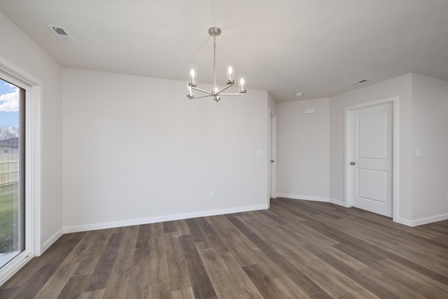 1756 Cash Dr, Mount Vernon, MO 65712 - empty room featuring visible vents, an inviting chandelier, dark wood-type flooring, and baseboards