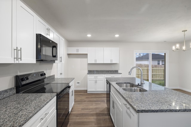 1756 Cash Dr, Mount Vernon, MO 65712 - kitchen with dark wood-style floors, baseboards, a sink, black appliances, and white cabinets