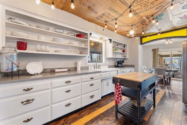 kitchen with white cabinets, dark wood-style floors, a healthy amount of sunlight, and open shelves