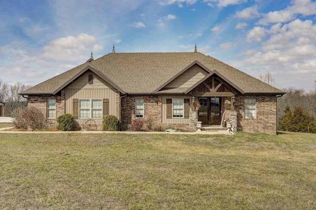 craftsman-style house featuring brick siding, board and batten siding, and a front yard