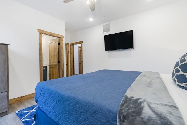 bedroom featuring baseboards, visible vents, a ceiling fan, wood finished floors, and recessed lighting