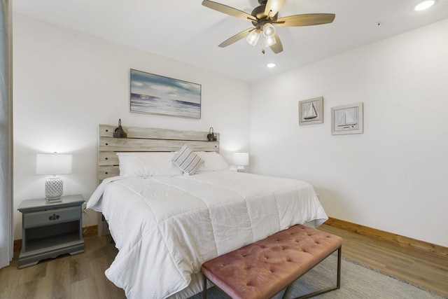 bedroom with a ceiling fan, recessed lighting, baseboards, and wood finished floors