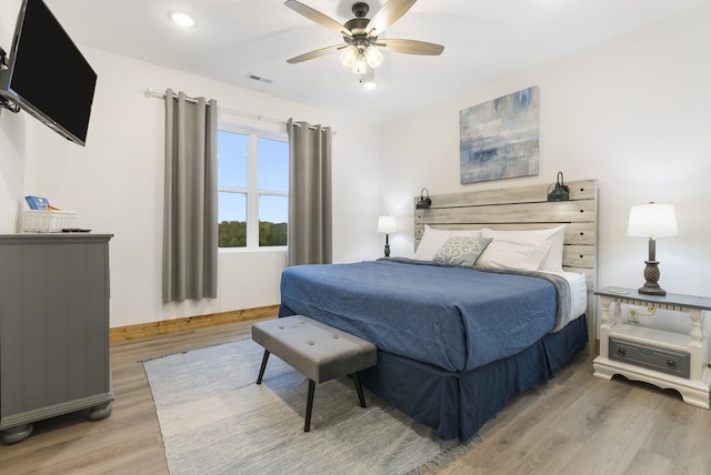 bedroom with recessed lighting, a ceiling fan, visible vents, baseboards, and light wood finished floors