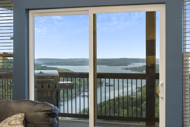 interior space featuring a healthy amount of sunlight and a water and mountain view