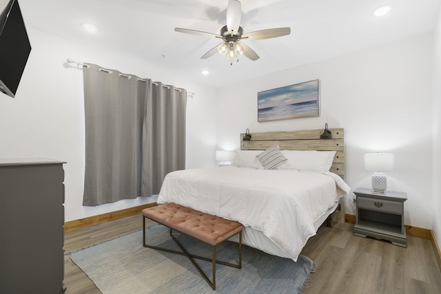 bedroom with baseboards, ceiling fan, wood finished floors, and recessed lighting