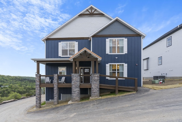 view of front of home with board and batten siding and central AC