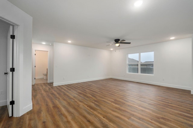 empty room with a ceiling fan, recessed lighting, baseboards, and wood finished floors