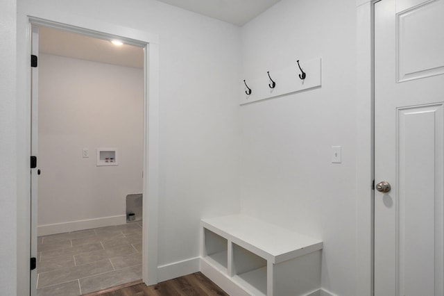 mudroom featuring wood finished floors and baseboards