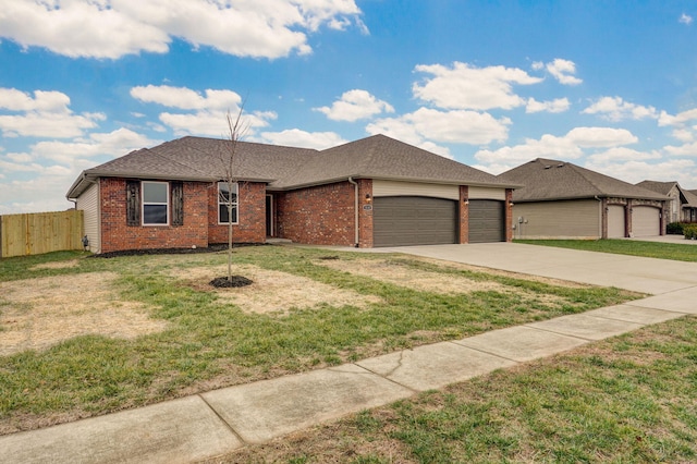 ranch-style home with a garage, driveway, fence, a front lawn, and brick siding