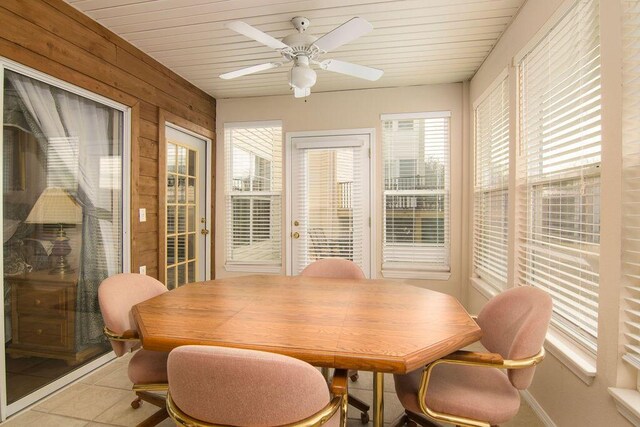 dining area with wooden ceiling, light tile patterned flooring, and a ceiling fan