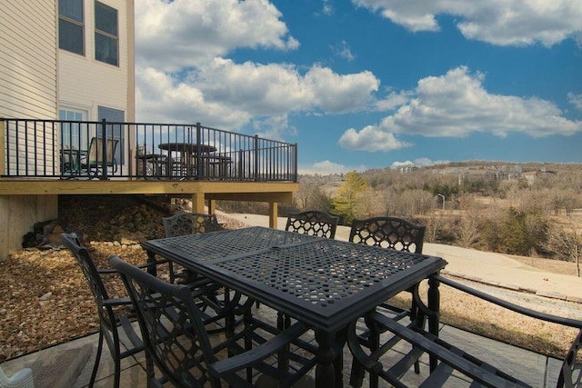 view of patio / terrace featuring a wooden deck and outdoor dining space