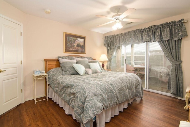 bedroom with access to exterior, dark wood-style flooring, visible vents, a ceiling fan, and baseboards