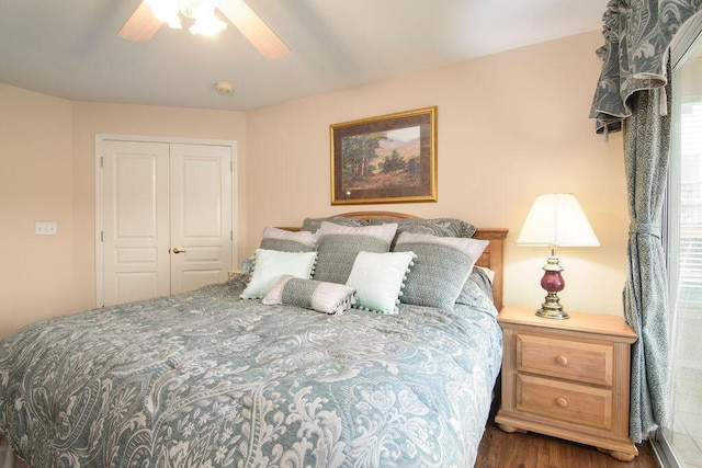 bedroom with ceiling fan, a closet, and wood finished floors