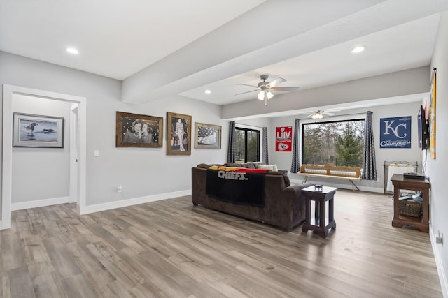 living room with light wood-type flooring, beamed ceiling, baseboards, and recessed lighting