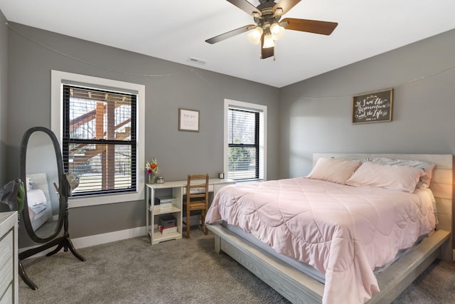 bedroom with baseboards, visible vents, a ceiling fan, vaulted ceiling, and carpet floors