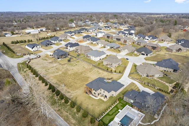 birds eye view of property with a residential view