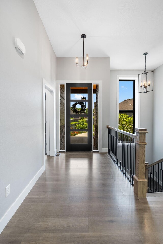 767 Thornridge Dr, Springfield, MO 65809 - foyer entrance featuring a chandelier, baseboards, and wood finished floors
