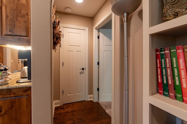 hallway with dark wood-style flooring