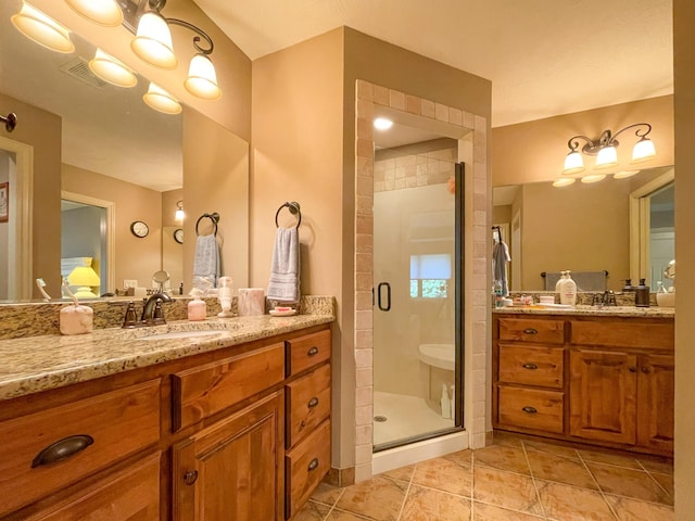 full bathroom with two vanities, a sink, visible vents, and a shower stall