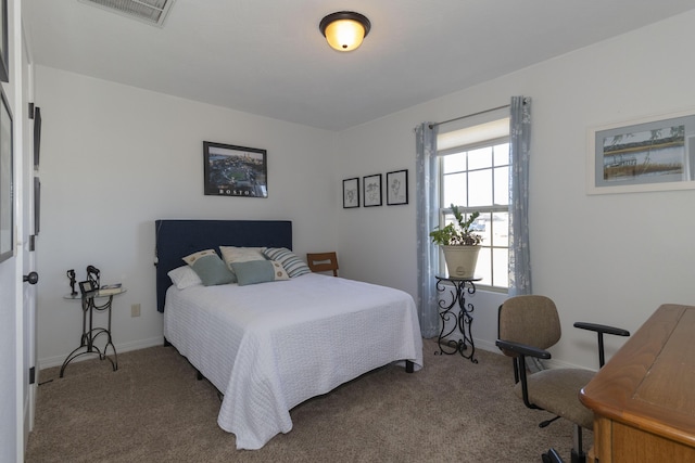 bedroom with carpet, visible vents, and baseboards