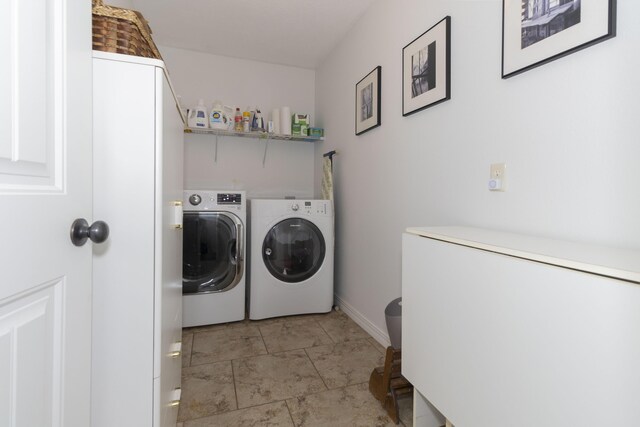 laundry room featuring laundry area and separate washer and dryer