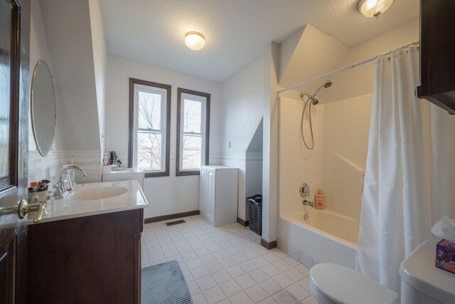 bathroom with toilet, visible vents, vanity, tile patterned floors, and shower / bath combo with shower curtain