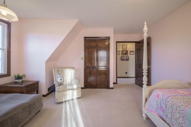 bedroom with carpet floors and baseboards