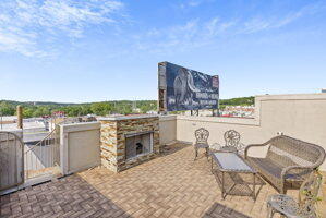 212 W Main St, Branson, MO 65616 - view of patio featuring an outdoor stone fireplace