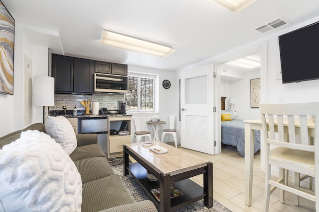 212 W Main St, Branson, MO 65616 - living room with visible vents