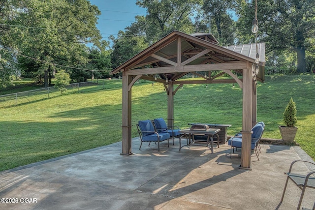 view of patio with fence and a gazebo