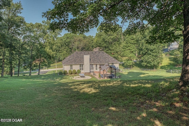 exterior space with an attached garage and fence