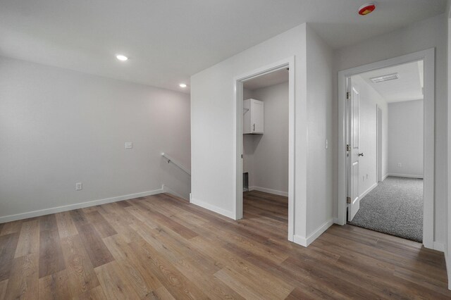 unfurnished bedroom featuring recessed lighting, baseboards, and light wood finished floors