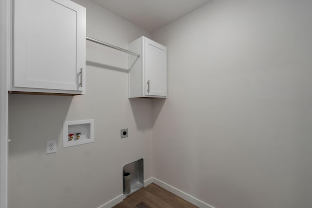 laundry area featuring hookup for a washing machine, baseboards, cabinet space, dark wood finished floors, and electric dryer hookup