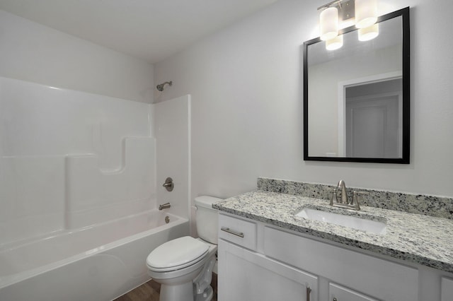 full bathroom featuring shower / tub combination, vanity, toilet, and wood finished floors