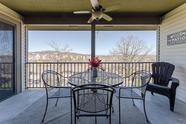 balcony featuring ceiling fan