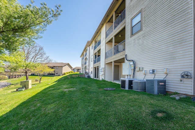 view of yard with central air condition unit