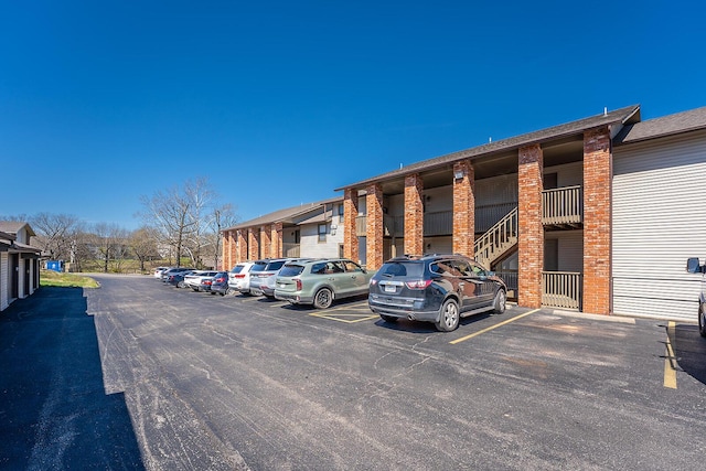 view of property featuring uncovered parking