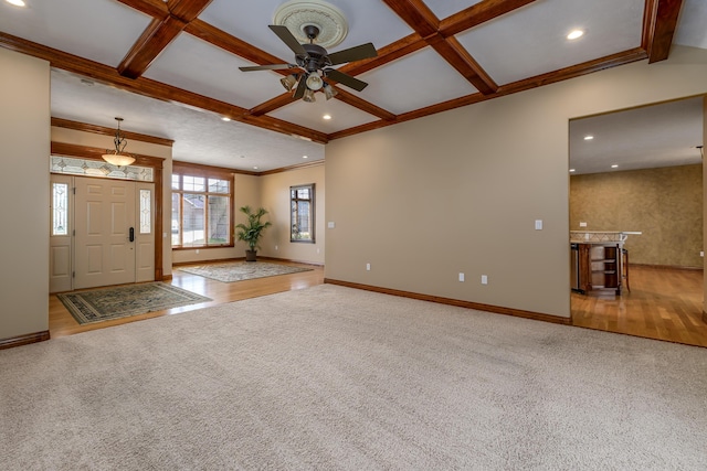 entryway with carpet floors, coffered ceiling, beam ceiling, and baseboards