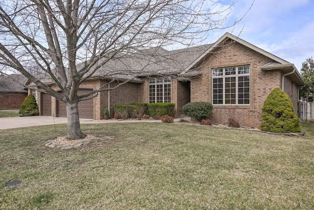 single story home featuring concrete driveway, brick siding, a front yard, and fence