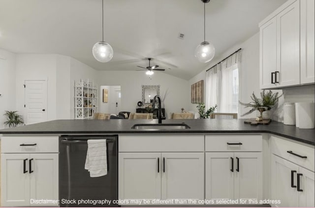 kitchen with dark countertops, dishwashing machine, white cabinets, and a sink