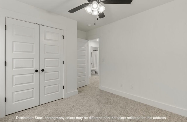 unfurnished bedroom featuring a ceiling fan, a closet, baseboards, and carpet flooring