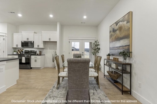 dining room with recessed lighting, visible vents, baseboards, light wood-style floors, and french doors