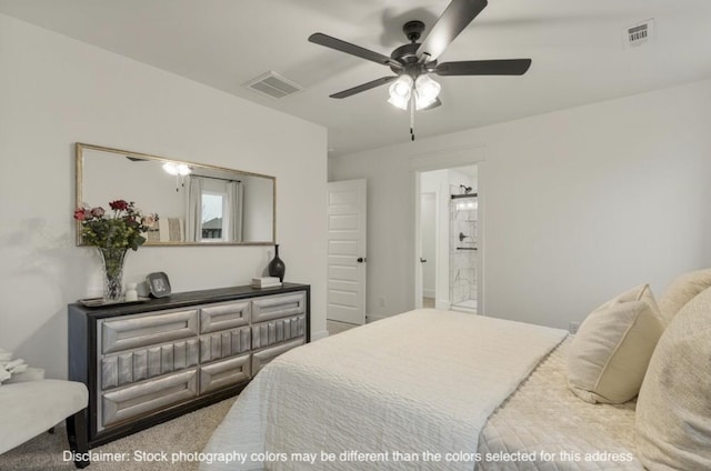 bedroom featuring a ceiling fan, carpet, visible vents, and ensuite bathroom