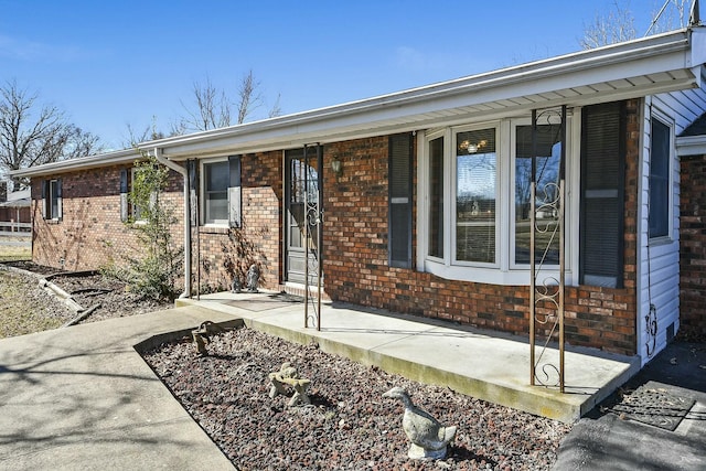 view of front of property featuring brick siding